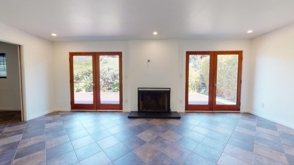 8242 Polizzi Pl San Diego CA 92123 - French doors and fireplace